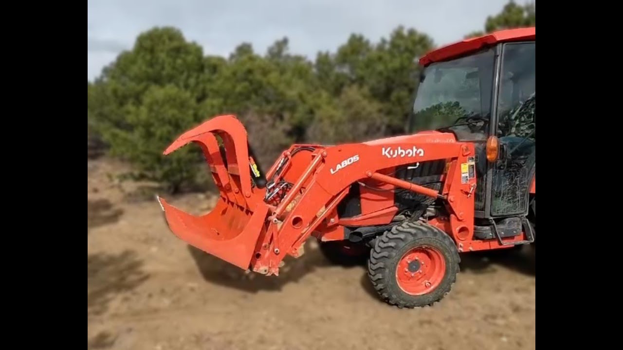 Grapple attachment on Kubota L3560 moving logs YouTube