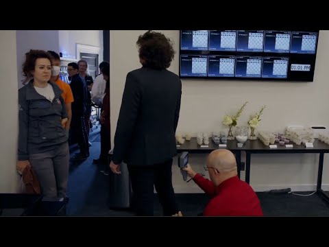 Security guard scans Hans Niemann's ass at the US Chess Championship checkpoint.