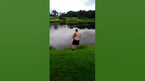 Golfer jumps in water for strokes