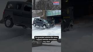 Watch! New York State Police Uses Armoured Vehicle To Pull Out Snow-Capped Cars