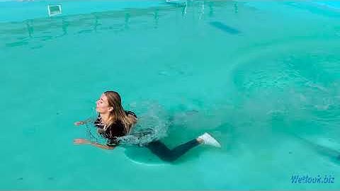 Wetlook swimming in pool | Wetlook wetting girl