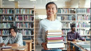 Pretty mixed race lady student carrying books walking in library smiling Guide