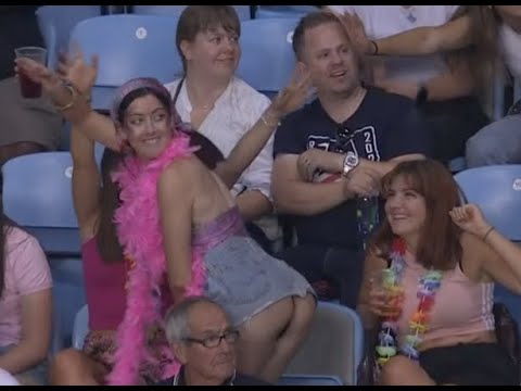 Woman in crowd shakes booty during Rugby sevens at the Commonwealth Games