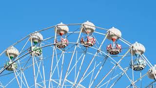 Ferris Wheel Close-Up Against Clear Blue Sky
