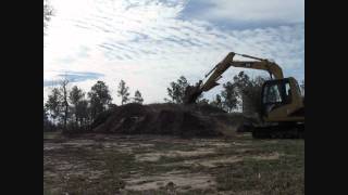 Cat 307c Blading Dirt Pile