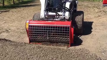 Scooping Gravel with a Cement Mixer Attachment for Skid Steer Loaders