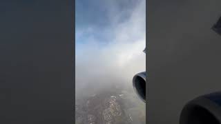 Flying Over An Airport Through The Clouds B737