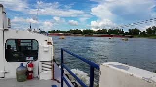 Cruising Down The Mississippi River On A Workboat