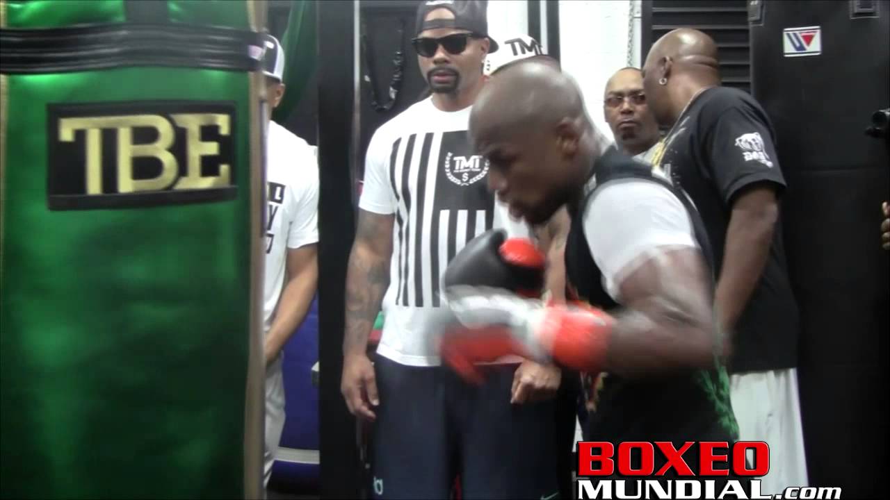 Mayweather hitting the heavy bag during his media day before Pacquiao