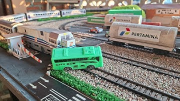 VINTAGE WHITE AND BLUE TRAIN CRASHES INTO CITY BUS