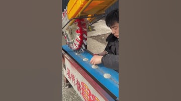 Demonstrating the sowing process of the seeder