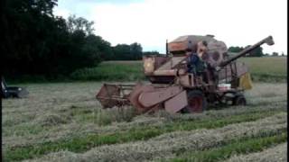 Dania vintage combine harvester working on farm.avi