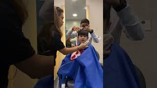 Eros cuts his hair getting ready for school