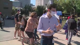 Supporters for Biden, Trump gather on opposite sides of the street