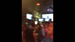 People in bar join in a USA chant
