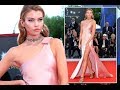 Stella Maxwell looks like Hollywood royalty as she puts on a very leggy display in clinging pink gow