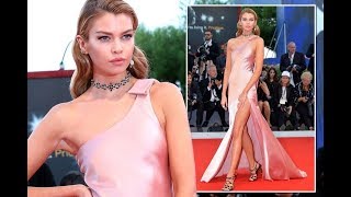 Stella Maxwell looks like Hollywood royalty as she puts on a very leggy display in clinging pink gow