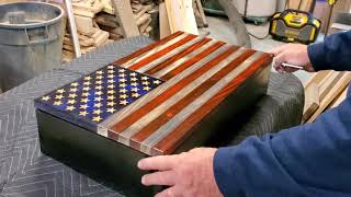 Small Wooden American flag concealment case.