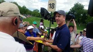 Former NFL quarterback Peyton Manning signs autographs after his pro-am round at the Memorial ...