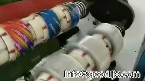 Automatic transparent tape slitting machine with auto paper core loader