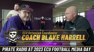 ECU Football Defensive Coordinator Blake Harrell with Pirate Radio’s Big Dog at 2023 Media Day.