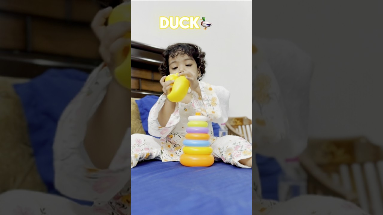 Baby playing with stacking ring