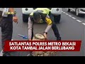 PRESISI UPDATE : SATLANTAS POLRES METRO BEKASI KOTA TAMBAL JALAN BERLUBANG 07/02/2026 (19.00)