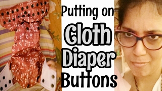 How to put the buttons on a cloth diaper | Infant care