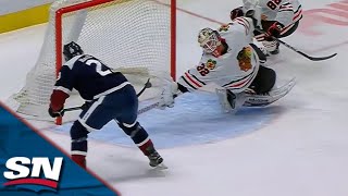 Blackhawks' Alex Stalock Reaches Out To Make Unbelievable Paddle Save On Nathan MacKinnon