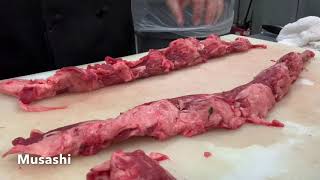 Trimming the chain of a beef tenderloin