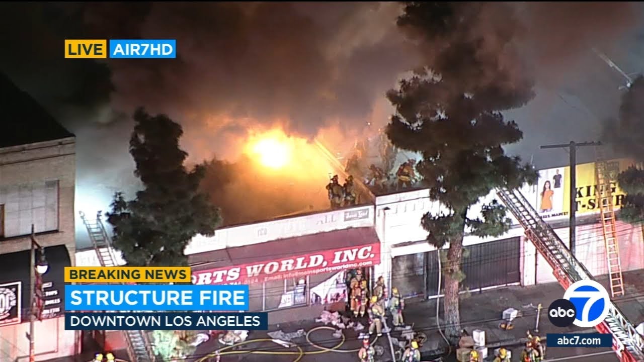 Dramatic fire erupts at commercial building in downtown LA's Fashion ...