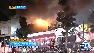 Dramatic fire erupts at commercial building in downtown LA's Fashion District