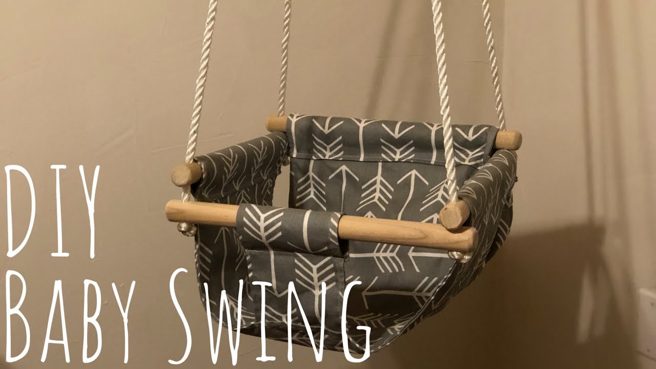 baby swing hanging from door