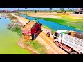 Road construction, Land filling, Bulldozer KOMATSU D31P, Dump Truck unloading
