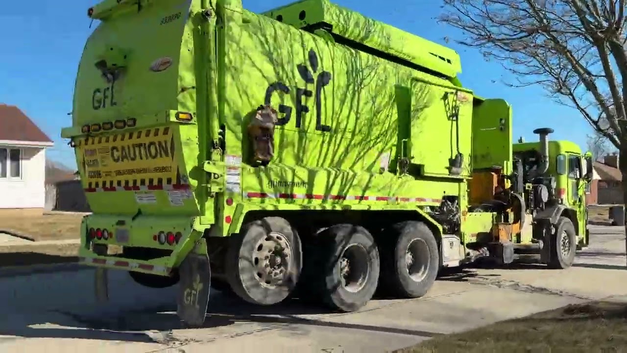 GFL Environmental’s CNG Peterbuilt 520 Labrie Expert picking up recycling part 3.