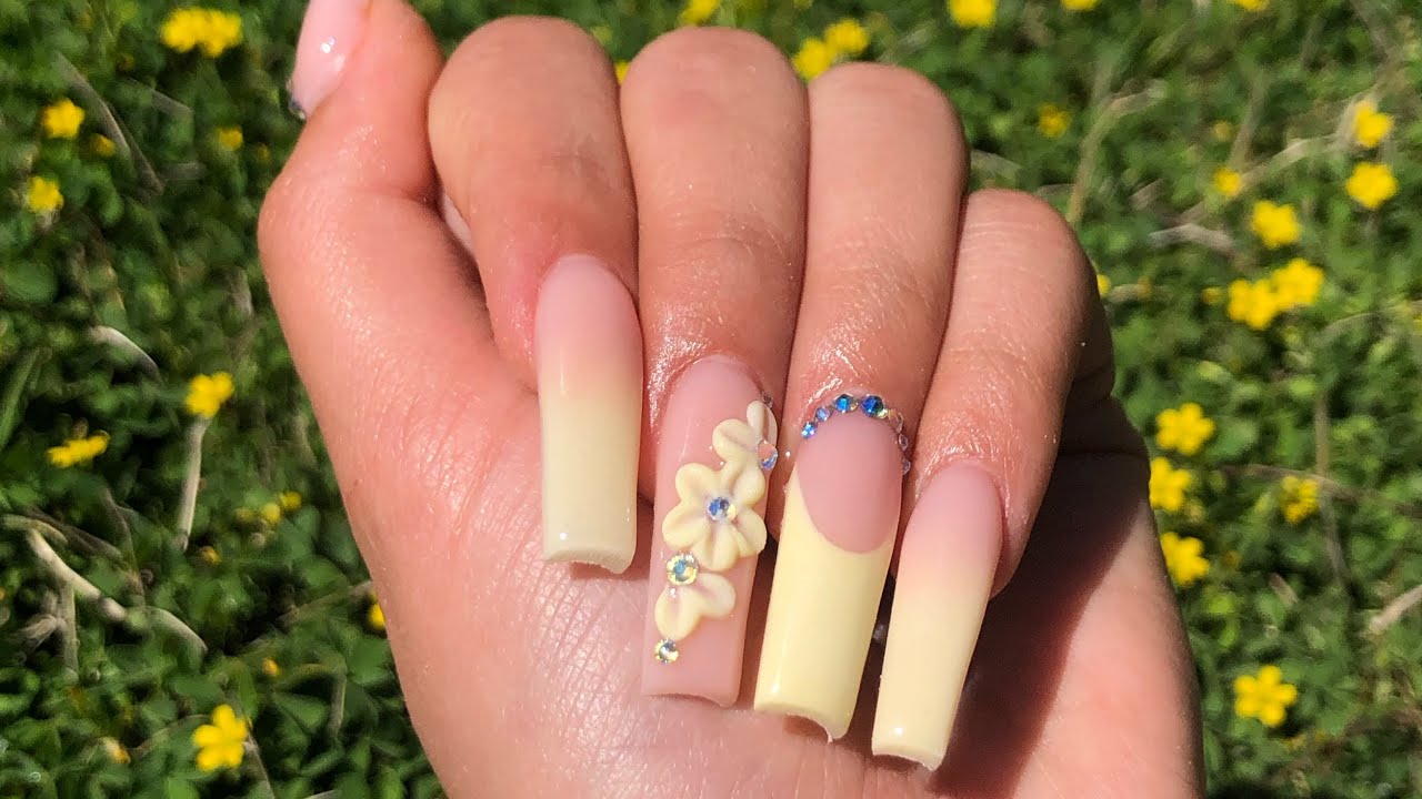 7. Peach and pastel rainbow nails with a single cloud design - wide 11