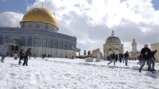 People are enjoying the Snowfall in the Courtyard of Al AQSA Mosque