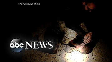 Photojournalist reveals graphic images of torture and execution by Iraqi troops