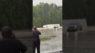 Truck Driver Scrambles Out of Cab as Vehicle Sinks in Texas Floods