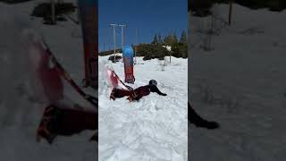 Boy rides sled down snow ramp and lands in scorpion position