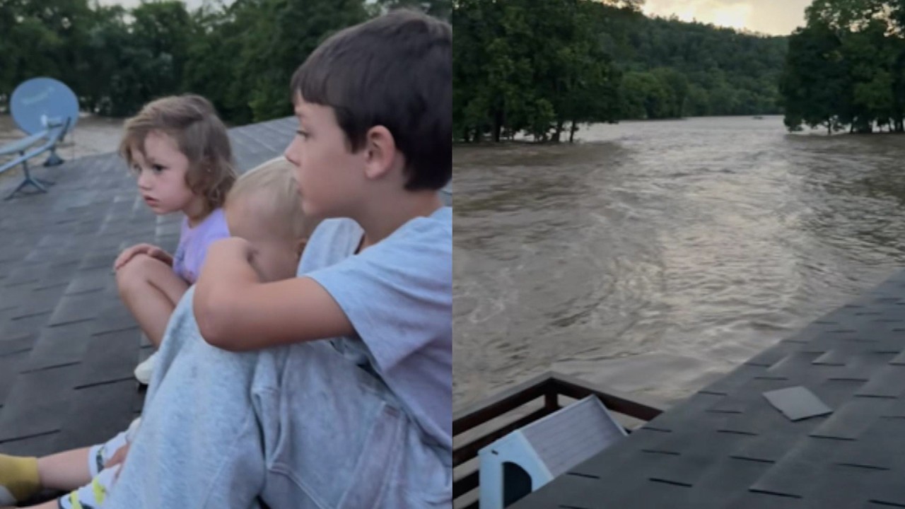 Family Trapped On Roof During Flood