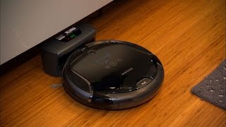 CNET News - A robot that vacuums while keeping an eye on the house