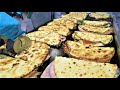 Italy Street Food. Large Flat Bread &#39;Spianata&#39; Stuffed with Ham, Salami, Cheese and more