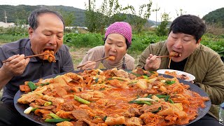 Pork and Kimchi stew cooked on a cauldron lid - Mukbang eating show