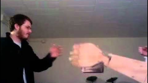 Giant Wooden Robot Arm Performs Secret Handshake