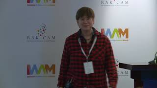 Erika Eiser presents Optofluidic crystallization of colloids tethered at interfaces at IWAM 2022