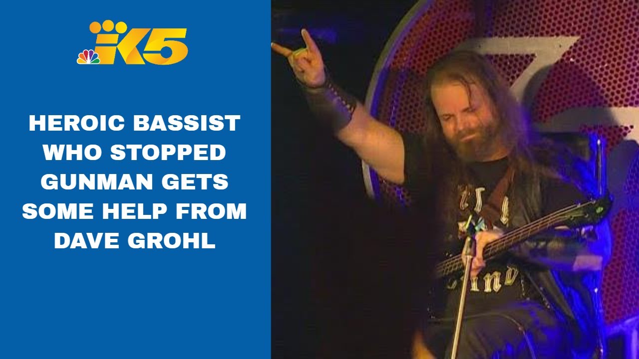 Dave Grohl helps bass player who stopped gunman return to the stage