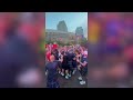 Boston police officer kicks it with World Cup fans at City Hall Plaza