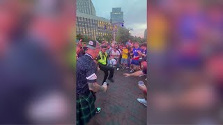 Boston police officer kicks it with World Cup fans at City Hall Plaza
