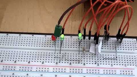 Raspberry Pi: semi-random blinking of 2 LEDs using 2 transistors with red recording LED